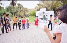  ??  ?? Children celebrate laying the foundation stone for the Najwa Al Qatami orphanage center funded by Kuwait