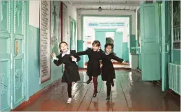  ?? Picture: PONOMAREV OLEG ?? EXUBERANCE: Young girls run through the corridors of their school as part of the Ponomarev Village School series.