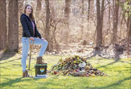  ?? Photos by Charlie Samuels Portraits & Films ?? Whitney Davis started Loving Earth Compost, a curbside composting service, last October in Saratoga Springs. She has 40 customers who place three-and-a-half-gallon buckets loaded with vegetable waste outside their homes.