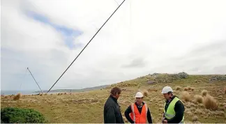  ??  ?? Pictured, from left: Landowner Graham Laidlaw, Energy3 Services Ltd technical director Matt Buchan, and Energy3 director Tom Cameron stand by as a test mast is put up for the Flat Hill wind farm near Bluff back in 2011. NICOLE GOURLEY/STUFF