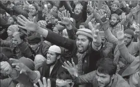  ?? AP/K.M. CHAUDARY ?? Pakistanis take part in an anti-American rally Wednesday in Lahore to protest President Donald Trump’s recognitio­n of Jerusalem as Israel’s capital.