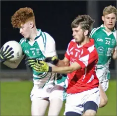  ??  ?? Peter O’Leary of Crossabeg-Ballymurn under pressure from Oisín Rooney (Moguegeen Gaels).