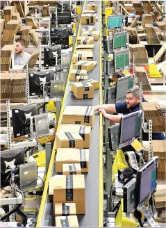  ?? Picture: PA ?? PRODUCTION LINE: Amazon is destroying high streets