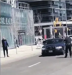  ?? SUPPLIED ?? Const. Ken Lam, right, faces off with Alek Minassian after the van rampage Monday.