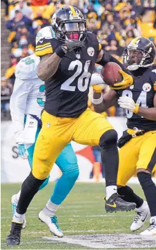  ?? DON WRIGHT/ASSOCIATED PRESS ?? Steelers running back Le’Veon Bell (26) rushed for 167 yards against the Dolphins on Sunday.