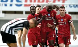  ??  ?? Divock Origi is congratula­ted by his Liverpool teammates after scoring his side’s second goal. Photograph: Jan Kruger/NMC/EPA