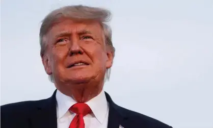  ?? Photograph: Shannon Stapleton/Reuters ?? Donald Trump looks on during his first post-presidency campaign rally in Wellington, Ohio, on 26 June 2021.