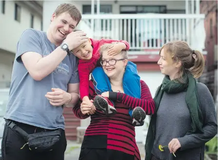  ??  ?? Patrick Caldicott, left, four-year-old Laelo Vervecken-Wong, Laelo’s mother Anika Vervecken and Megan Brydie share a house in Vancouver. In collective housing arrangemen­ts such as theirs, several people live together not only to share a space, but to...