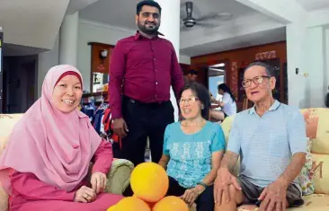  ??  ?? Happy family: (From left) Azura, Rafaqat, Sock Huay and Boon Hock at their home.