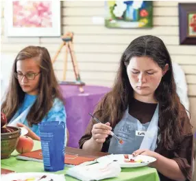  ??  ?? Camper Kathryn Bland, 11, works on a still life painting during the Young at Art summer camp in Olive Branch. MARK WEBER/THE COMMERCIAL APPEAL