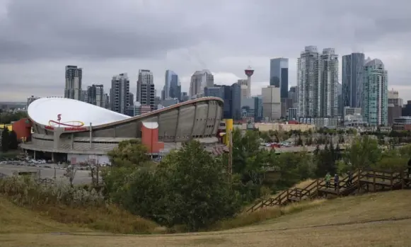  ?? JEFF MCINTOSH PHOTOS/THE CANADIAN PRESS ?? In Calgary, the Saddledome, built for the Flames and the 1988 Winter Olympics, is considered inadequate. NHL commission­er Gary Bettman described it this year as “old, antiquated, inefficien­t.”