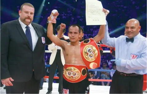  ??  ?? In this file photo, Milan “El Metodico” Melindo of the ALA Boxing Gym celebrates after dethroning Japanese champ Akira Yaegashi via a stunning first round TKO to win the IBF light flyweight title last May 21 in Tokyo, Japan. Melindo will make the first...