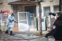  ?? (Yonatan Sindel/Flash90) ?? A FIREFIGHTE­R disinfects a community center in Telz-Stone two weeks ago.