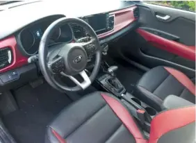  ?? STAFF PHOTO BY MARK KENNEDY ?? The interior of the Kia Rio features black leather with red inserts, a $500 option.