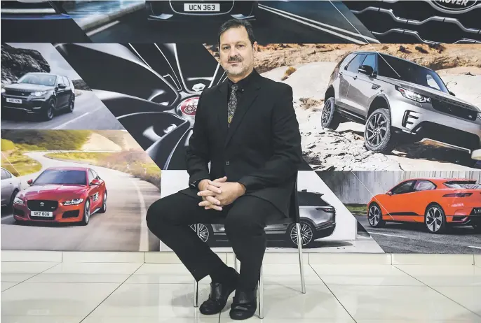  ?? Picture: Jacques Nelles ?? JUSTIFIABL­Y PROUD. Dawie Olivier, Jaguar Land Rover national aftersales manager, in his offices in Irene, Pretoria.