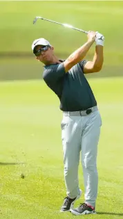  ?? AFP ?? Paul Casey of England plays a shot on the first hole during the third round of the Tour Championsh­ip at East Lake Golf Club in Atlanta. —