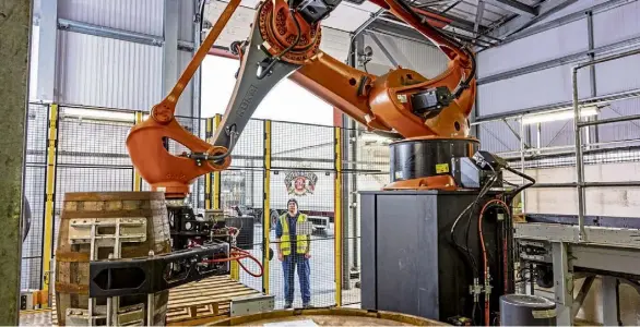  ?? ?? Clockwise, from left, Robots at work in Keith. Data analysts are now an essential part of the whisky business. Lucy Nicoll, associate director of recruitmen­t firm Eden Scott, and Brian MacAulay, malt distilling and operations director, Chivas Brothers.