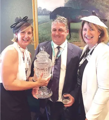  ??  ?? Sue Ridgway (left) and Kate Grossek with Warning trainer Anthony Freedman after last year’s win at the AAMI Victoria Derby.