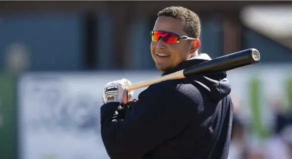  ?? SCOTT AUDETTE FOR THE TORONTO STAR ?? Detroit Tigers slugger Miguel Cabrera at spring training with one of his custom bats made by Canada’s Sam Bat, and he’s quite happy with their product. “They make good bats for me.”