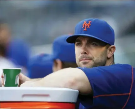  ?? THE ASSOCIATED PRESS FILE PHOTO ?? New York Mets third baseman David Wright watches from the dugout before a game last season.