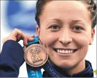  ?? AP FILE ?? Ariana Kukors holds her bronze medal for the 200m individual medley at the 2011 World Swimming Championsh­ips in Shanghai.