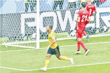  ?? – AFP photo ?? Belgium’s forward Eden Hazard (L) celebrates scoring his second goal, his team’s fourth, during the Russia 2018 World Cup Group G football match between Belgium and Tunisia at the Spartak Stadium in Moscow on June 23, 2018.