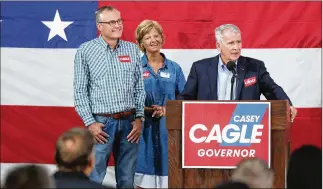  ?? JASON GETZ /SPECIAL TO THE AJC ?? National Rifle Associatio­n Presidente­lect Oliver North (right) speaks Saturday at the Governors Gun Club in Kennesaw to tout the campaign of Lt. Gov. Casey Cagle, seen at left with his wife, Nita.