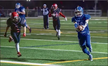  ?? NEWS PHOTO RYAN MCCRACKEN ?? Crsescent Heights Vikings’ Tony Simmons punches in a touchdown run while McCoy Colts’ Colton Robinson chases him down during a Rangeland Footba l l Conference semifinal game at the Methanex Bowl on Friday.