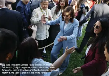  ?? U.S. Vice President Kamala Harris greets Sen. Tammy Duckworth (D-IL) during a reception celebratin­g Asian American, Native Hawaiian and Pacific Islander Heritage Month in the Rose Garden of the White House ??