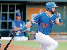  ?? [PHOTO BY BRYAN TERRY, THE ?? Edwin Rios (24) of the Oklahoma City Dodgers drives in a run during a Triple-A baseball game between the Oklahoma City Dodgers and the Salt Lake Bees at Chickasaw Bricktown Ballpark on Wednesday.