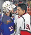  ?? DAVID JALA/CAPE BRETON POST ?? Newfoundla­nd goalie Brandon Short, left, congratula­tes Kameron Junior Miners goaltender Levi Denny after the host Miners captured the 2018 Don Johnson Memorial Cup on Sunday at the Membertou Sport and Wellness Centre