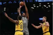  ?? MARY ALTAFFER — THE ASSOCIATED PRESS ?? Brooklyn Nets forward LaMarcus Aldridge (21) shoots a 3-pointer past Indiana Pacers guard Brad Wanamaker (10) and forward Domantas Sabonis (11) Friday in New York.