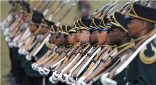  ?? AP-Yonhap ?? The National Ceremonial Guard lines up for a 21-gun salute in Pretoria, South Africa, Saturday.