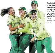  ?? Picture: ?? Shabnim Ismail of SA, left, is mobbed after taking a wicket in the Women’s World T20 this week.