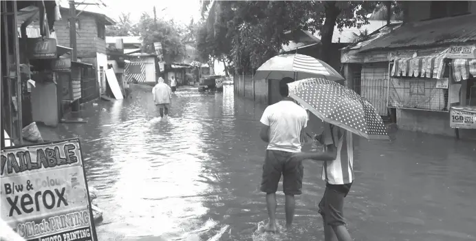  ?? (LYNDE SALGADOS) ?? RESIDENTS in low-lying areas of Cagayan de Oro have started feeling the `chilling effect’ of non-stop rains brought by tropical depression Domeng.