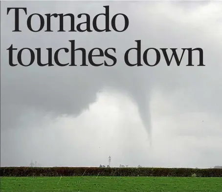  ??  ?? A twister tears through Taranaki in this picture taken by Geoff Christophe­rs.