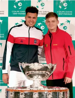  ??  ?? Frence’s Jo- Wilfried Tsonga ( left) and David Goffin of Belgium pose with the trophy at the draw ceremony for the Davis Cup final in Lille, France on Thursday. —