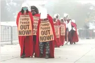  ?? ( Ken Cedeno/ Reuters) ?? ACTIVISTS DRESSED in ‘ Handmaid’s Tale’ costumes protest the Supreme Court nomination of Amy Coney Barrett in Washington yesterday.