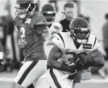  ?? Brett Coomer / Staff photograph­er ?? Undrafted free agent running back Damarea Crockett (36) scored a touchdown during goal-line drill Wednesday.