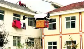  ?? AP ?? A JD.com drone takes off last year from Tiantong’an village in eastern China’s Jiangsu province.