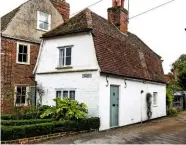  ??  ?? Moss Cottage, Constable’s first studio, which he is said to have rented for four and a half old pennies (approximat­ely 2p) a year. Cows in the shallows of the river and grazing on the open pasture beyond.