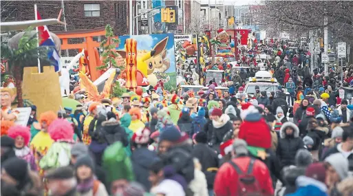  ?? STEVE RUSSELL PHOTOS TORONTO STAR ?? The staging area at Christie Pits is packed before the parade begins. Two new floats this year brought the total to 32, making it the largest in the parade’s history.