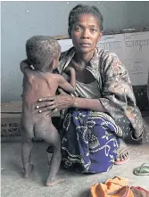  ??  ?? FOOD CRISIS: Left, a woman and child waiting to be treated by a doctor.