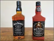  ?? (AP/Jessica Gresko) ?? A bottle of Jack Daniel’s Tennessee Whiskey is displayed next to a Bad Spaniels dog toy Sunday in Arlington, Va.