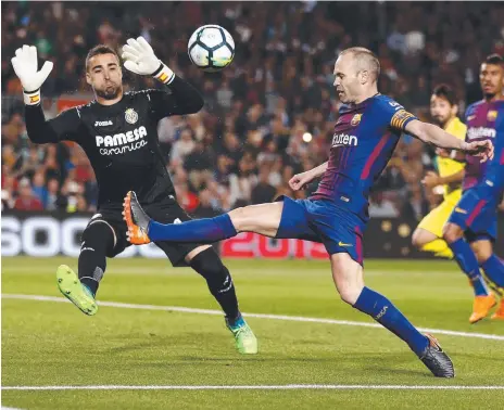  ?? Picture: AP PHOTO ?? Andres Iniesta (centre) in action for Barcelona against Villarreal during a Spanish La Liga match.