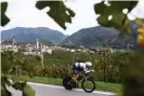  ?? Photograph: Tim de Waele/Getty ?? Filippo Ganna heads through the vineyards.