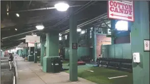  ?? The Associated Press ?? FENWAY PARK: A workout area sits idle in the concourse under the first base stands on Thursday in Boston. The Boston Red Sox are scheduled resume training camp Friday at Fenway.