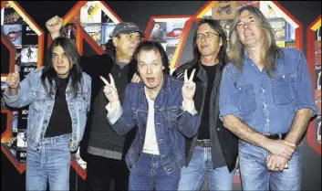  ?? Yui Mok The Associated Press ?? From left, Malcolm Young, Brian Johnson, Angus Young, Phil Rudd and Cliff Williams from AC/DC in March 2003 at the Apollo Hammersmit­h in London.
