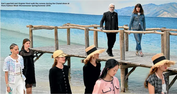  ??  ?? Karl Lagerfeld and Virginie Viard walk the runway during the Chanel show at Paris Fashion Week Womenswear Spring/Summer 2019.