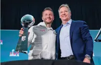  ?? MARCIO JOSE SANCHEZ ?? Rams head coach Sean McVay, left, holds the Vince Lombardi trophy during a news conference Monday while posing for photos with league commission­er Roger Goodell. The Rams beat the Bengals in the Super Bowl on Sunday in Los Angeles.